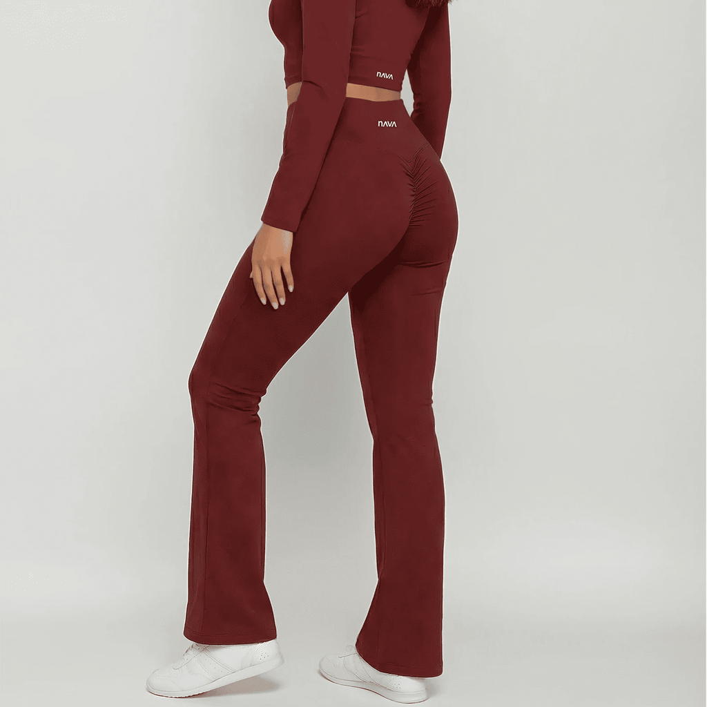 Maroon outfit with flared pants on a white background