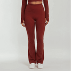 Maroon outfit with high-waisted pants and long-sleeve top on a white background