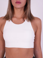 NAVA Milky Quartz high-neck sports bra front view on model