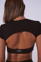 Black sports bra with 'Nava' brand logo on a plain background