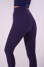NAVA Arc Sodalite leggings back side view in deep blue showing sculpting fit and high-waist contour